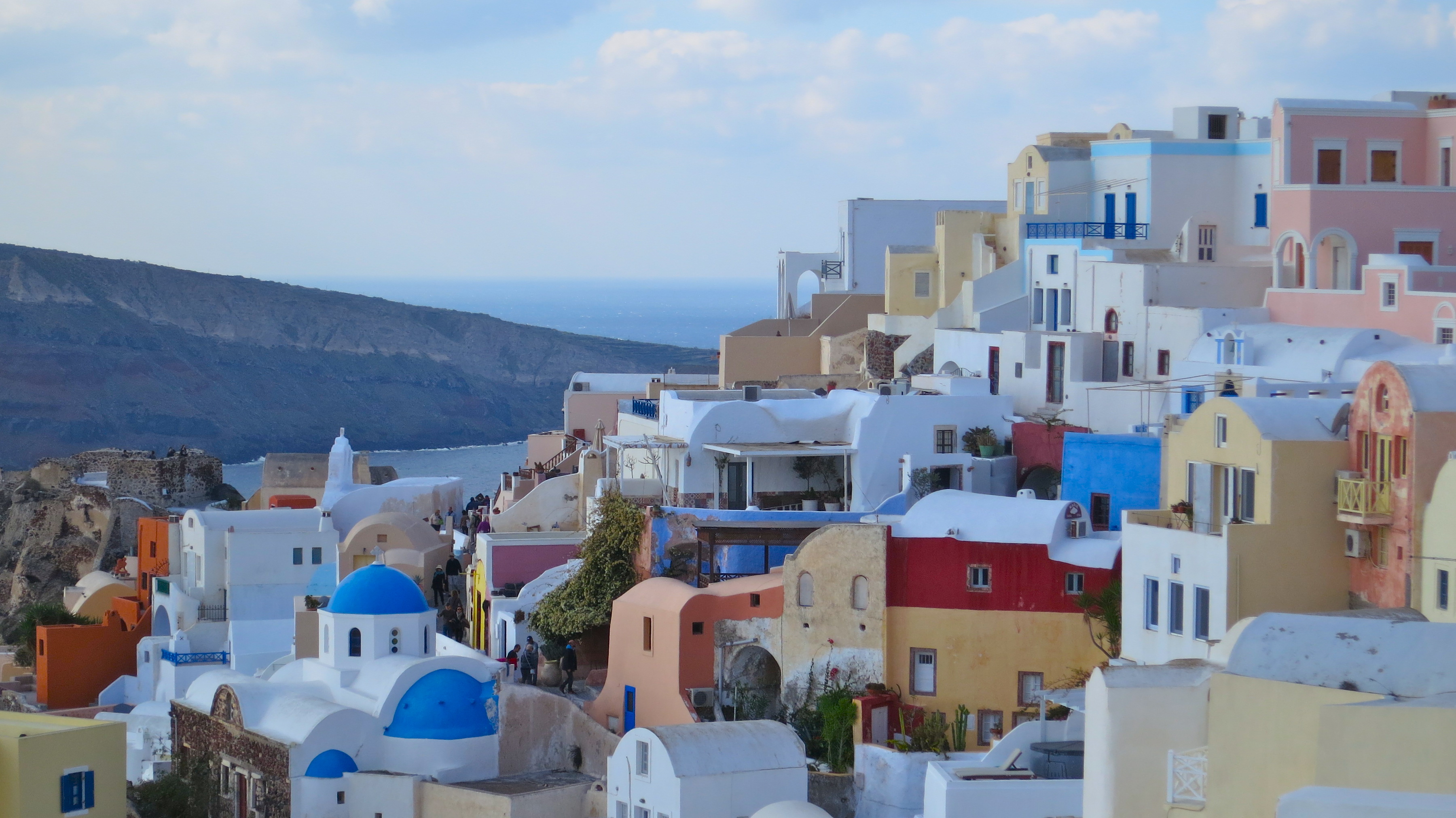 Buildings cascade down the cliffs on the Greek island of Santorini located in the Aegean Sea.