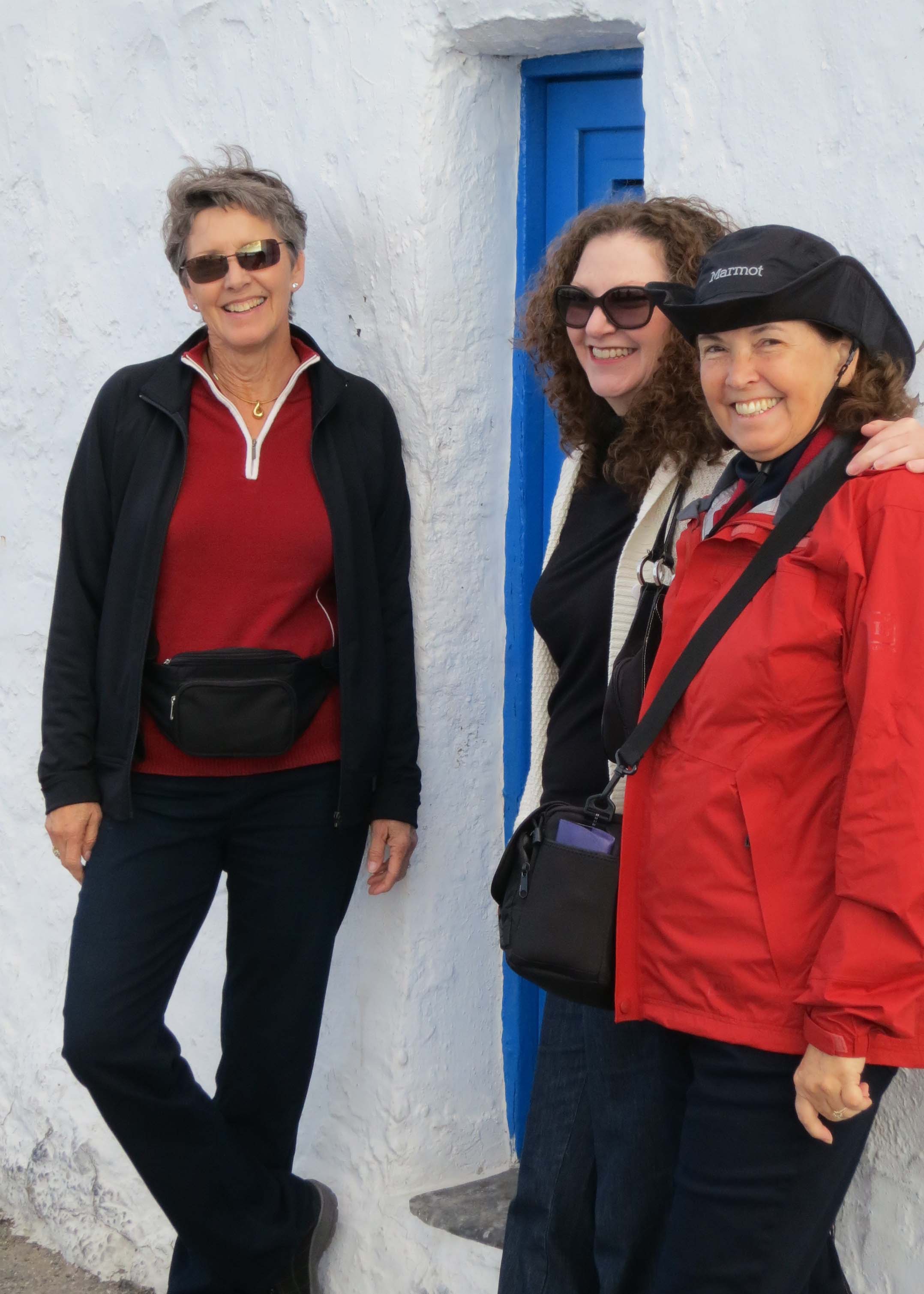 My wife Peggy on the right and two of our traveling companions, Kathi and Frances stand in front of another blue door.