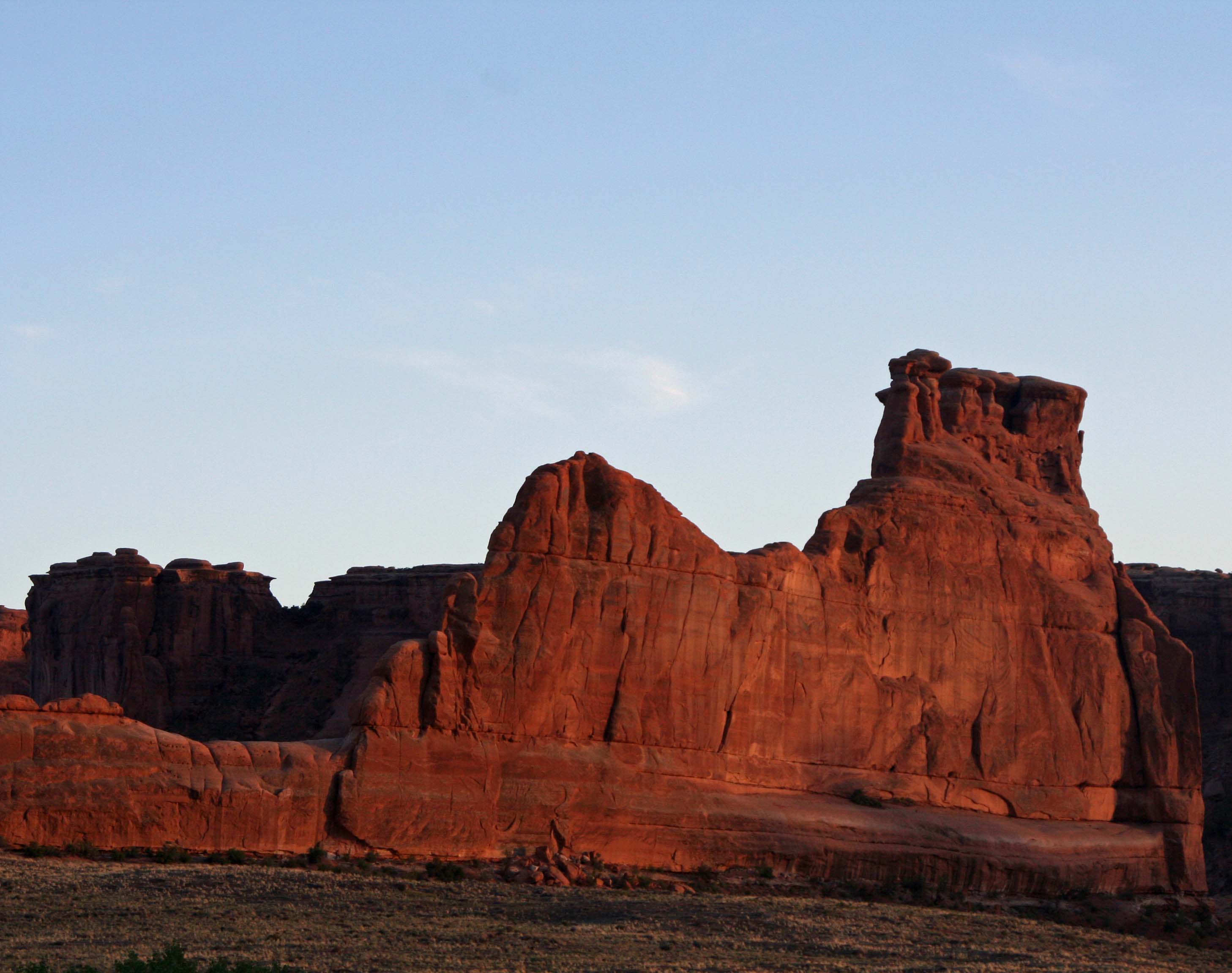 Evening sun turns a rock sculpture red in Arches National Park. Photo by Curtis Mekemson.