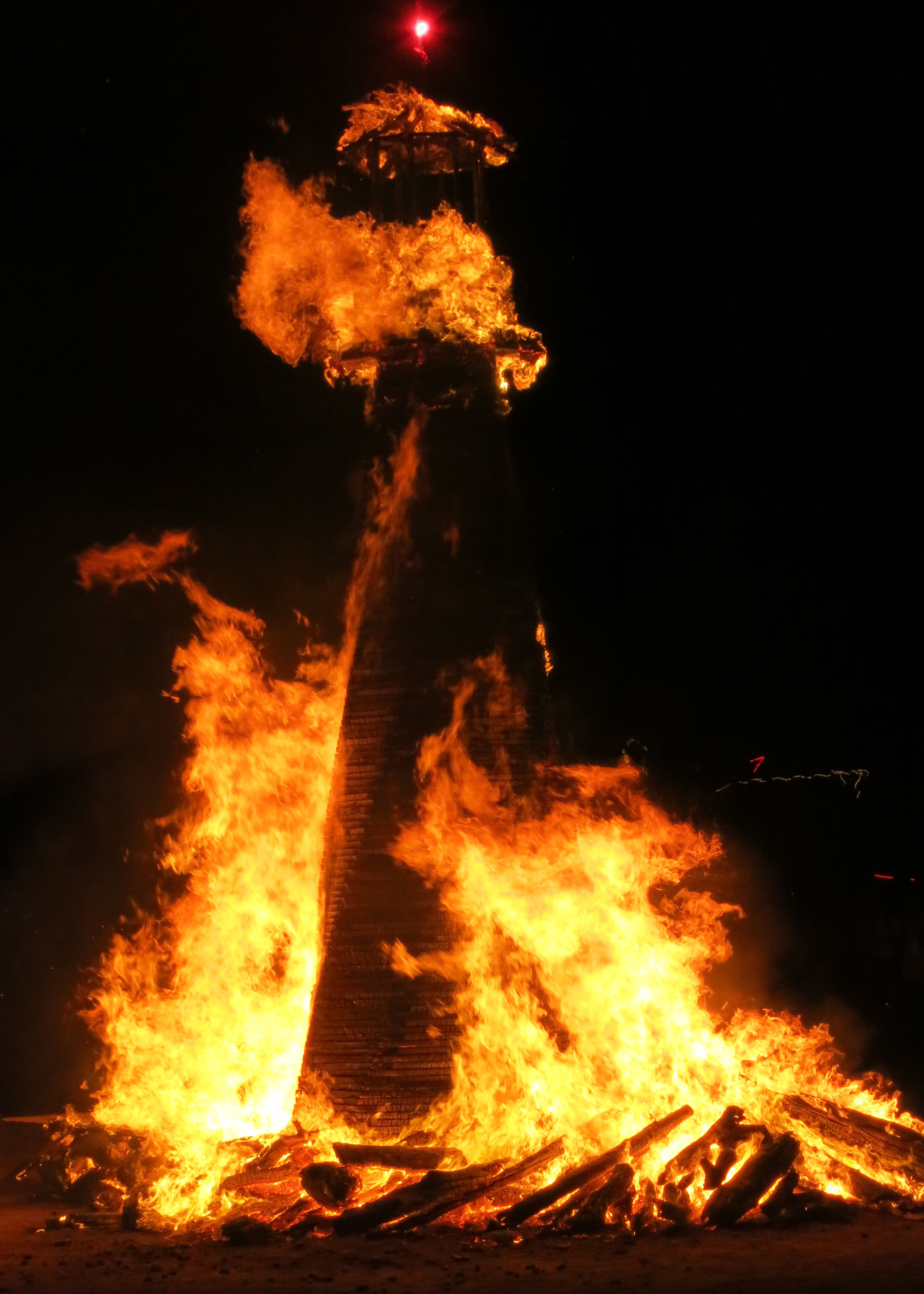 The burning of the Man provides Burning Man with its name, but there are many other burns. This was a light house created by burners from the North Coast of California. Last year over 20 regional art pieces were burned simultaneously on Thursday night.