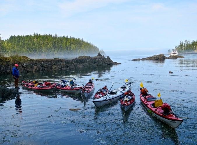Sea Kayak Adventure kayaks roped together in small inlet on Hanson Island. Photo by Curtis Mekemson.