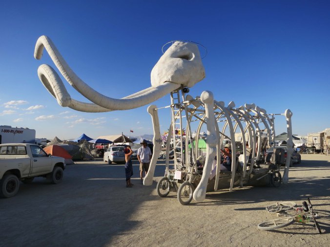 The tusks on they mammoth are what make this art car one of my favorite mutant vehicles at Burning Man. People sit inside the rib cage. The driver climbs into the head.