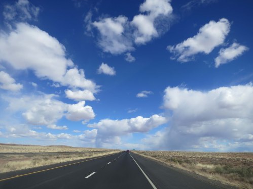 Wide open country, fluffy clouds, a broad shoulder— and for the moment, no vehicles.