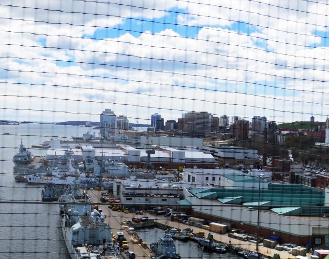 Looking back at Halifax through the screened fence on the bridge.