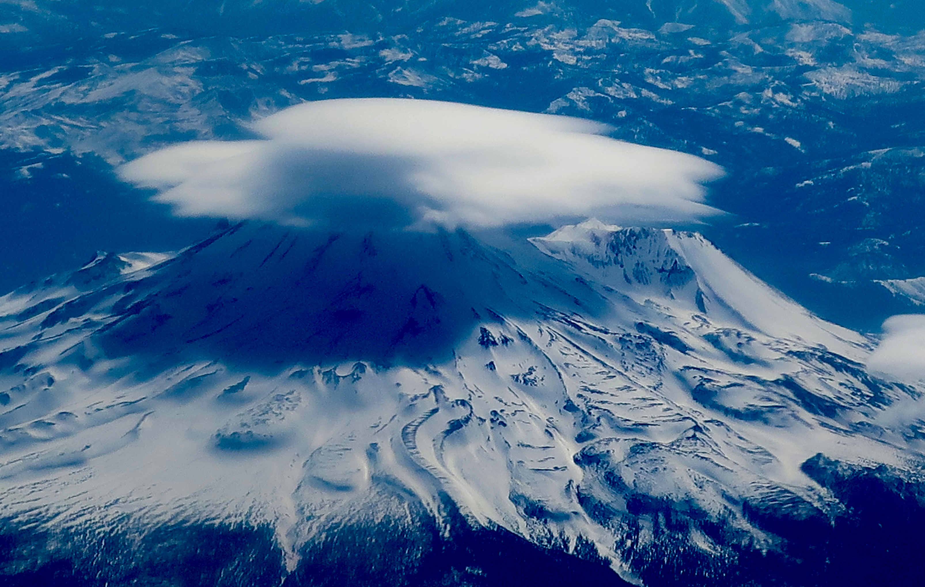 Airplane photo of lenticular cloud over Mt. Shasta on April 10, 2023 by photographer Curt Mekemson.